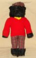 Teddy bear with tartan trews and red sweater